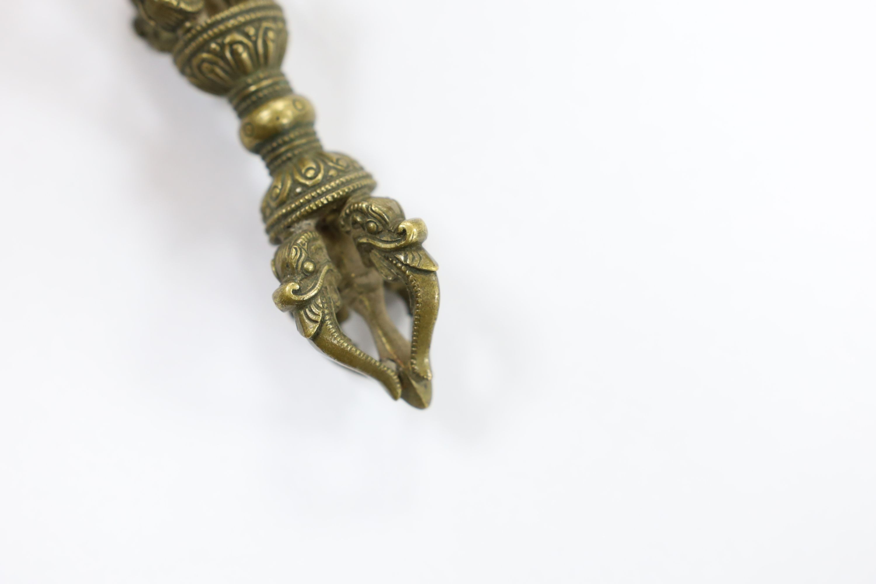 Five Chinese or Tibetan bronze figures or Buddhist implements, tallest 13cms high